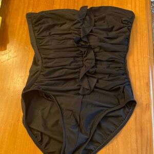 Miaclesuit Black strapless black one piece with ruffle down the front.  Size 12.